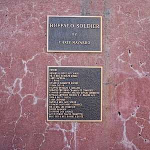 Buffalo Solider by Chris Navarro  Image: A bronze plaque mounted on the sculpture base that says:
"Donors
Howard & Peggy Hutchings
Dr. & Mrs. Rudolph Gomez
Larry Jackson
P. J. Ross®
Taylor & Elisabeth Haynes
Trisha Taveor
Colonel Oswaldo Y. Mullins
Greater Cheyenne Chamber of Commerce
Chamber of Commerce Military Affairs Committee
Civilian Advisory Council F. E. Warren AFB
John & Patty Tresco
Carol Jennings
Mayor & Mrs. Jack Spiker
Wyoming Governor’s Residence
Mr. & Mrs. Lee Courtney
Louise Raimondi
Cheyenne City Council
Art in Public Places Committee
Brig. Gen. & Mrs. Robert R. Scott"