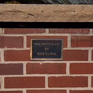 The Great Blue by Rich Haines  Image: Bronze Plaque that says: Rich Haines - The Great Blue