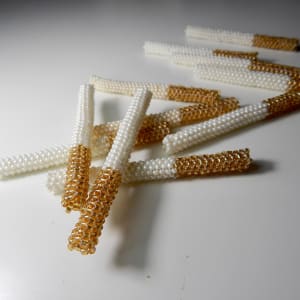 Cigarettes by Noelle Garcia  Image: Noelle Garcia 
"Cigarettes," 2015
Glass beads and thread
Marjorie Barrick Museum of Art Collection 
Gift of the artist