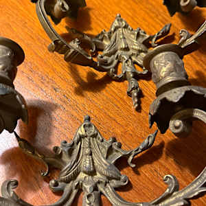 Pair of ornate brass wall mounted candelabra 