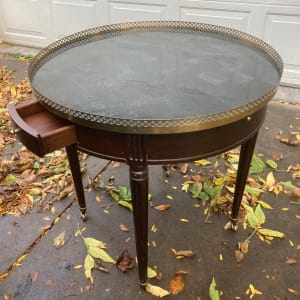Round mahogany side table with brass gallery 