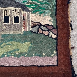 Hand hooked cottage scene rug 