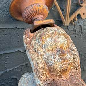 Cast iron garden wall mounted winged cherub 