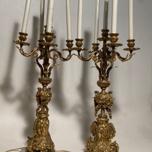 Pair of tall electrified ornate candleabra with marble bases 