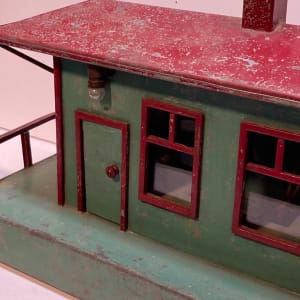 Folk art metal painted depot with lights 