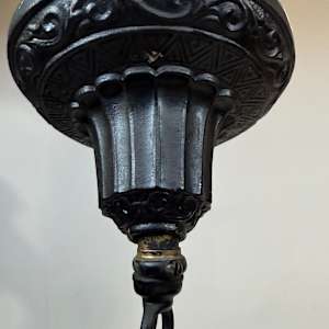 1920's entry iron light fixture with amber glass 