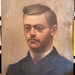 Framed painting on board of man with glasses
