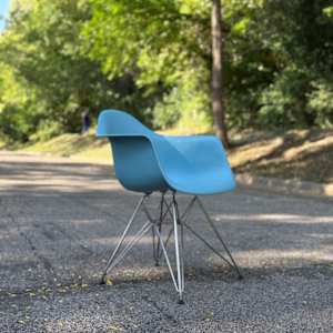 Blue Herman Miller shell arm chair
