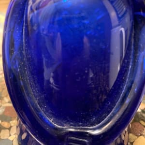Kosta Boda blue bottle with face stopper by Erik Hoglund 