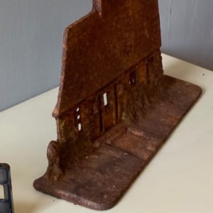 Vintage cast iron cottage door stop 