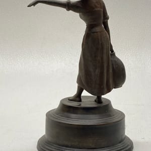 Sculptural woman carrying water 