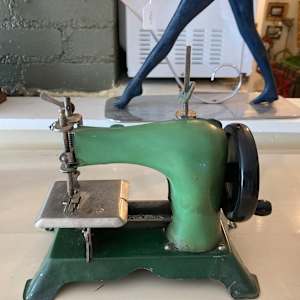 vintage green toy sewing machine 