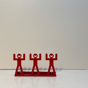 post modern red figural wall shelf 