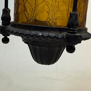 1920's entry iron light fixture with amber glass 