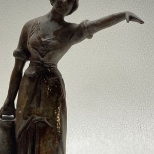 Sculptural woman carrying water 