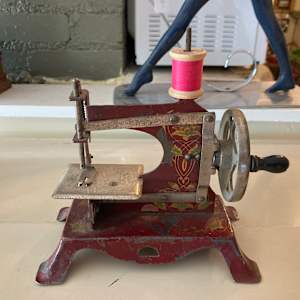 Red vintage toy sewing machine 