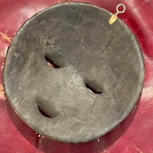 Carved mask with shells 