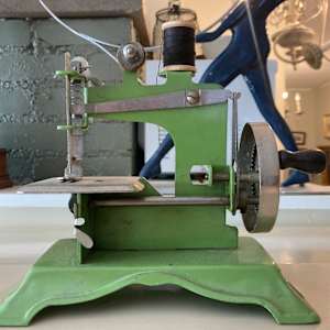 vintage green toy sewing machine 