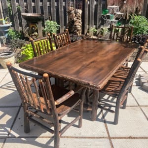 hand  made log table and 6 chairs 