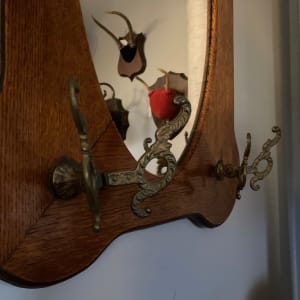 Turn of the century oak mirror with hooks 