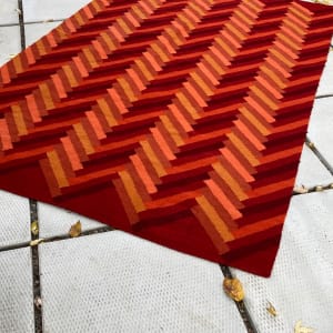 Hand made orange woven wool rug 