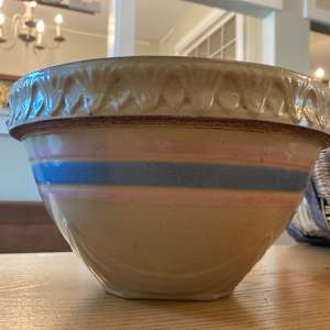 Pottery mixing bowl with pink and blue stripe 