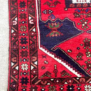 Vintage handmade wool rug red blue and cream center 