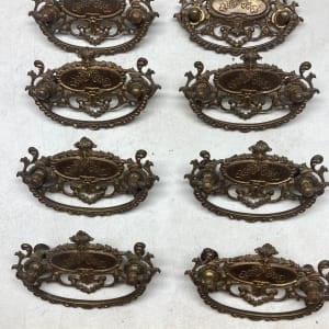 Set of 8 ornate handles 