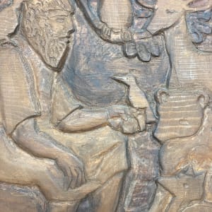 Carved wooden animal and woodsman plaque 
