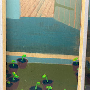 framed Greenhouse window into garden 