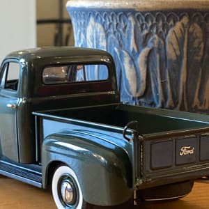 Die cast vintage dark green Ford truck 