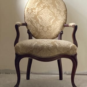 Pair of upholstered ornate medallion back chairs