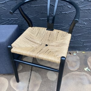 pair of black wishbone chairs 