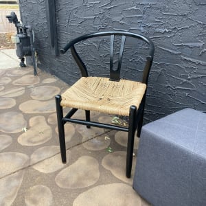 pair of black wishbone chairs 