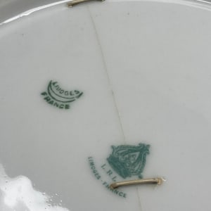 hand painted bird plate with old repairs 