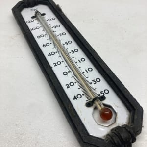 vintage metal and porcelain thermometer