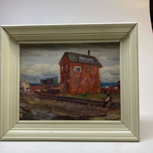 Framed rail yard painting with red building on board 