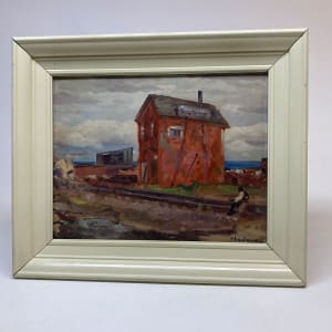 Framed rail yard painting with red building on board 