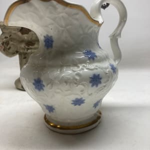 hand painted porcelain pitcher with blue decorations