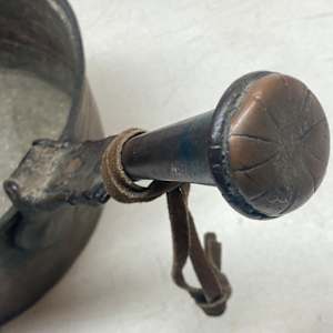 medium sized copper sauce pan with interesting handle 