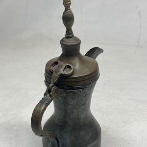 Vintage covered copper pitcher