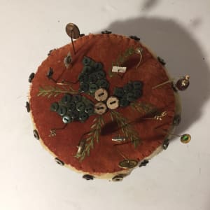 round pin cushion with pins 