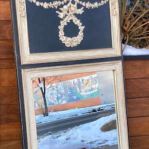 Carved Trudeau mirror 