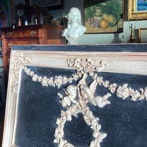 Carved Trudeau mirror 