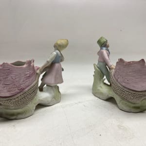 Pair of bisque porcelain Dresden kids with shell vases 