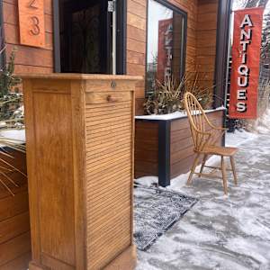 Narrow oak sheet music cabinet 