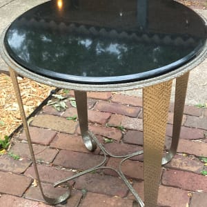 Round black marble topped table 