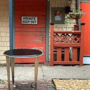 Round black marble topped table 