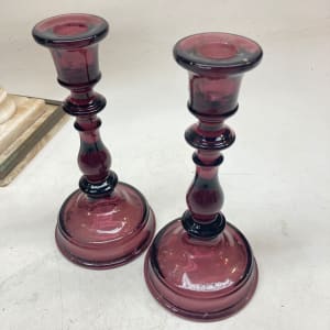 Pair of amethyst glass candle sticks 