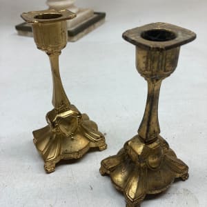 Pair of gold colored small candle sticks 